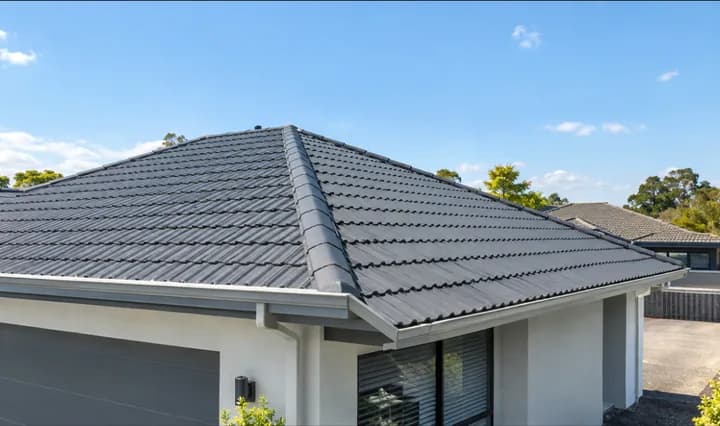 Illustration: the same tiled roof after a soft wash, tiles clean and even
